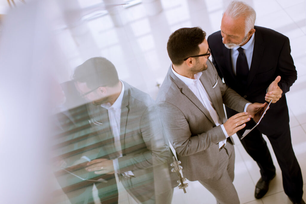 Above view of young businessman pointing and showing something